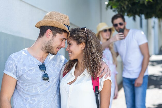 Hip couple looking at each other on the street