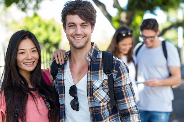 Hip couple posing for camera in the street