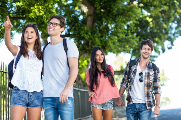 Hip friends going on a walk in the streets