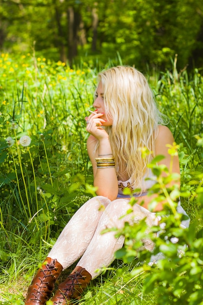 Hippies girl sitting and smoking