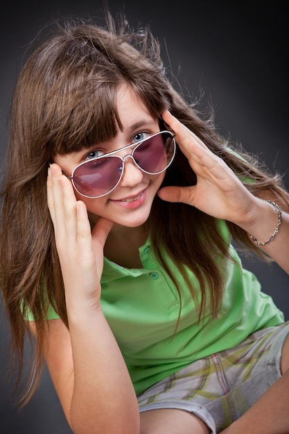 Hippy girl is wearing sunglasses