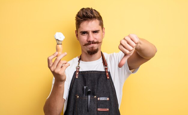 Hipster barber man feeling crossshowing thumbs down