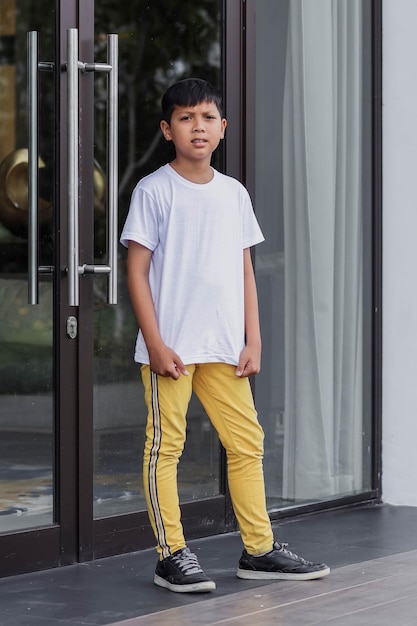 Hipster boy wearing a plain white tshirt for a mock up tshirt