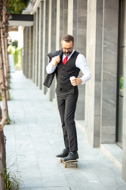 hipster businessman on skateboard