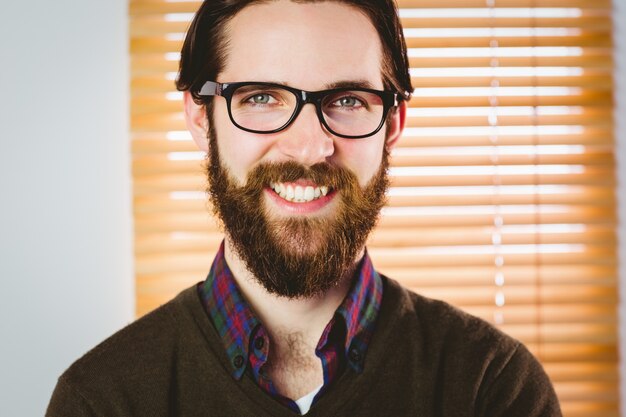 Hipster businessman smiling at camera