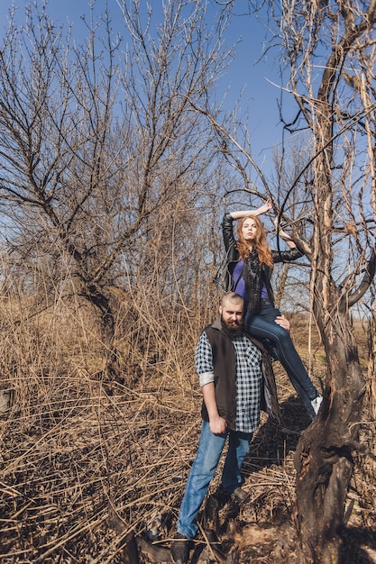 Hipster couple girl with red hair and shaved bearded man