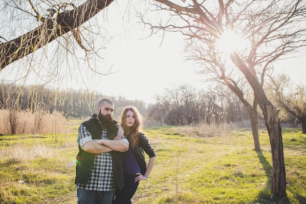 Hipster couple girl with red hair and shaved bearded man