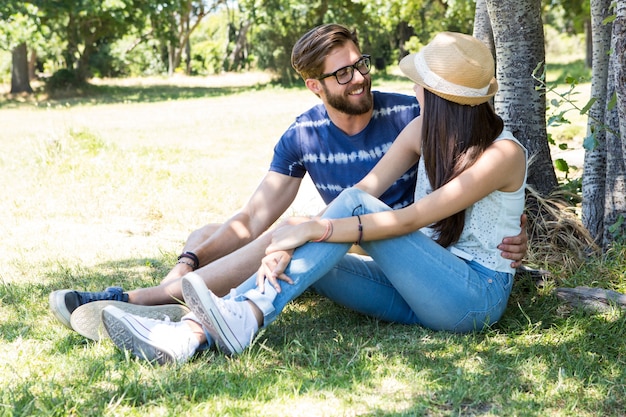 Hipster couple relaxing in the park