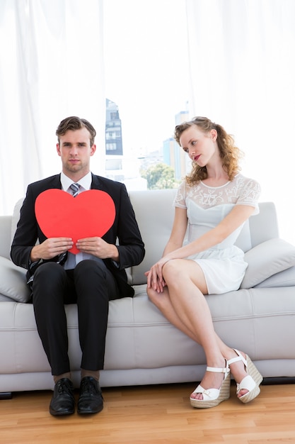 Hipster couple sitting on couch 