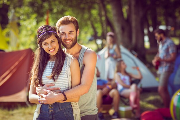 Hipster couple smiling at camera