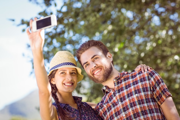 Hipster couple taking a selfie