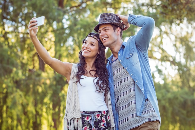 Hipster couple taking a selfie