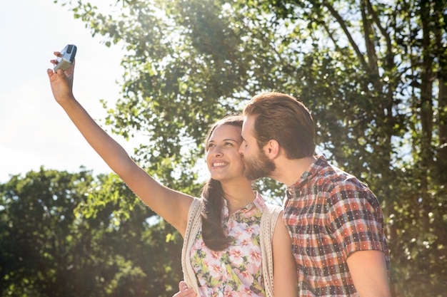 Hipster couple taking a selfie