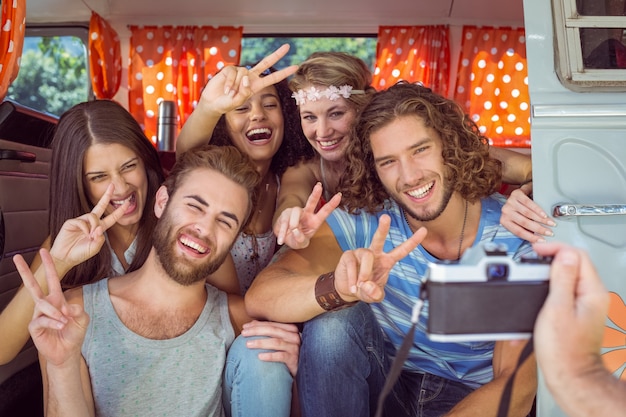 Hipster friends in a camper van