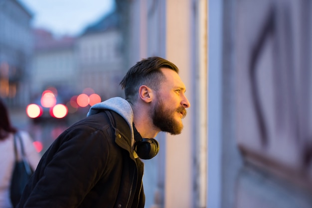 Hipster man checking a storefront