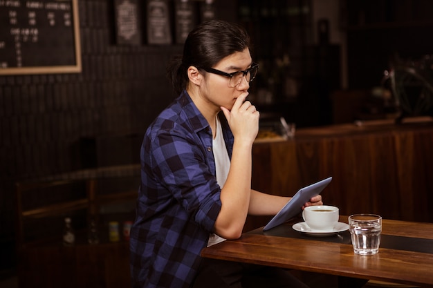 Hipster man using tablet 