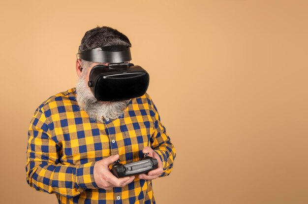 Hipster man with virtual reality glasses and game controller