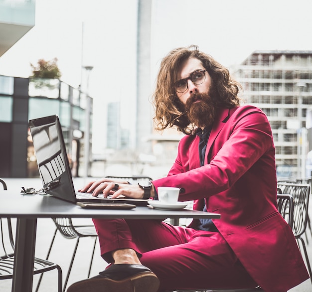 Hipster man working at computer