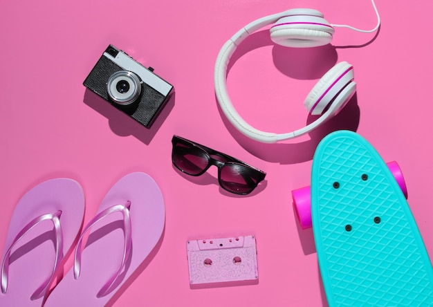 Hipster outfit Skateboard audio cassette headphones flip flop retro camera sunglasses