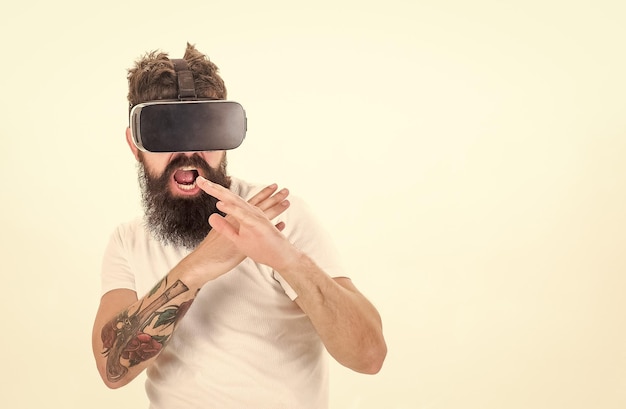 Hipster play virtual sport game man bearded gamer vr glasses\
white background virtual reality game concept cyber sport guy with\
head mounted display interact virtual reality virtual activity