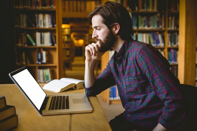 Hipster student studying in library