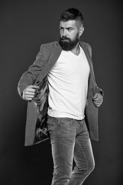 Hipster wear comfy outfit Caucasian man with brutal appearance Bearded man with moustache and beard on unshaven face in brutal style Brutal hipster wearing casual outfit Clothes shop Menswear