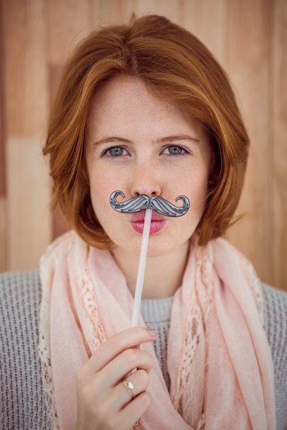 Hipster wearing a fake mustache