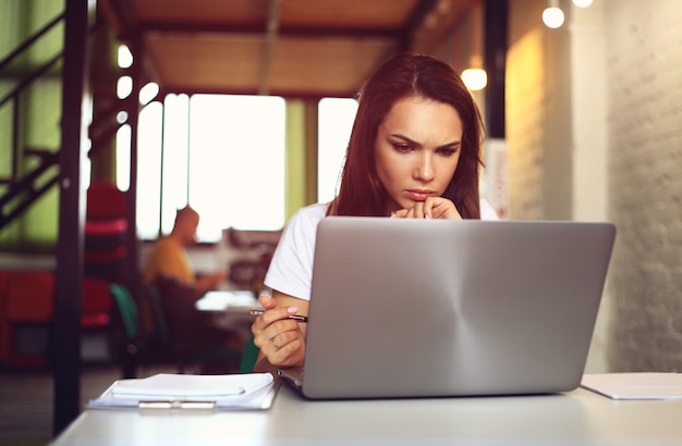 Hipster Woman use Laptop huge Loft Studio.Student Researching Process Work.