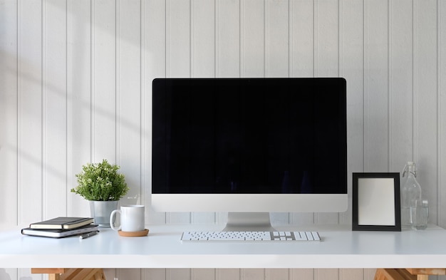 Hipster workspace computer, poster frame and gadget