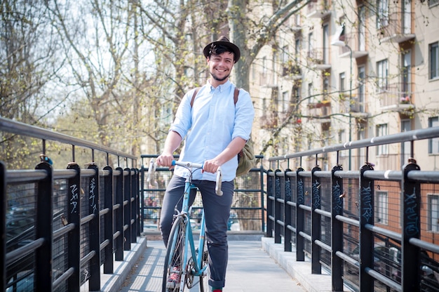 hipster young man on bike