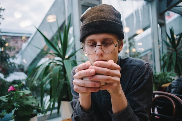 Hipster young man at a coffee shop