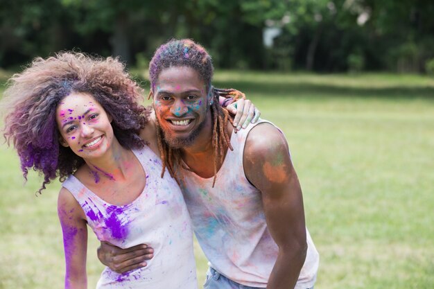 Hipsters covered in powder paint