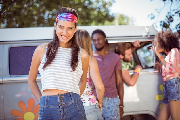 Hipsters hanging out by camper van 