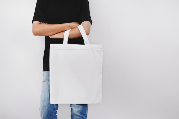 Hipter woman holding eco fabric bag