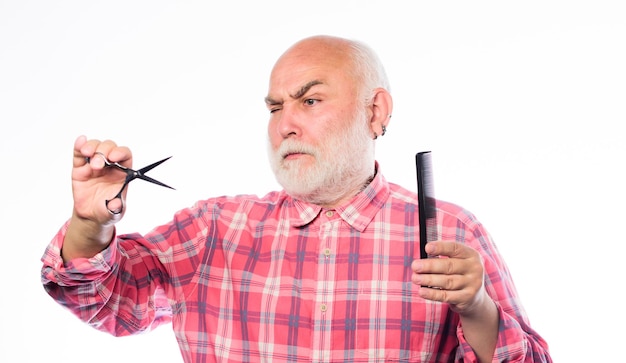 In his own style unshaven old man has moustache and beard cut and brush hair mature bearded man isolated on white barbershop concept shaving accessories shaving tool kit