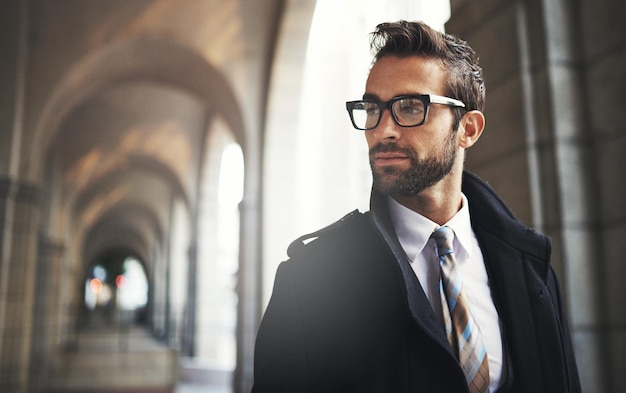 His style says a lot about him Shot of a stylish young businessman in the city