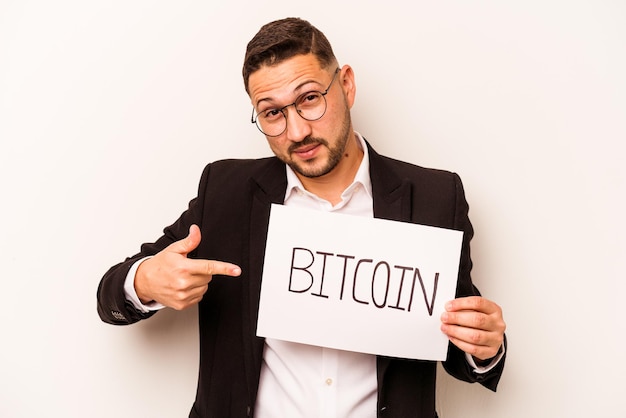 Hispanic business man holding a bitcoin placard isolated on white background