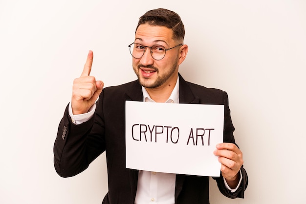 Hispanic business man holding a crypto art placard isolated on white background