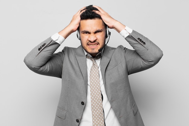 Hispanic businessman angry expression telemarketer concept