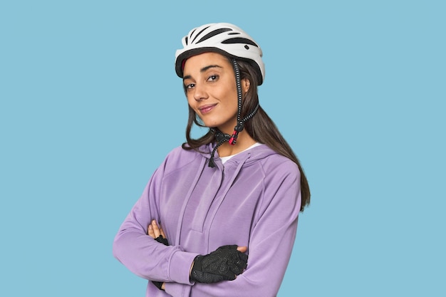 Hispanic cyclist in helmet fitness focused