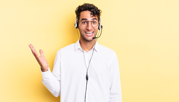 Hispanic handsome man feeling happy, surprised realizing a solution or idea. telemarketer concept