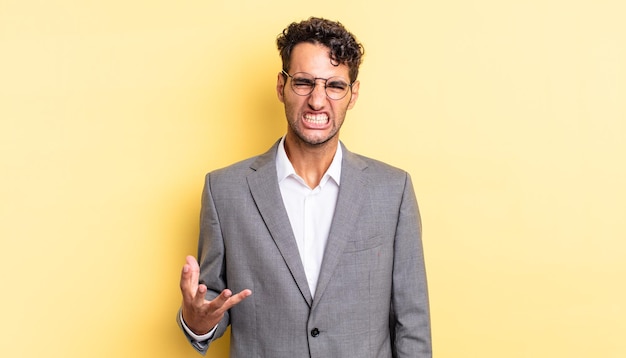 Hispanic handsome man looking angry, annoyed and frustrated. business concept