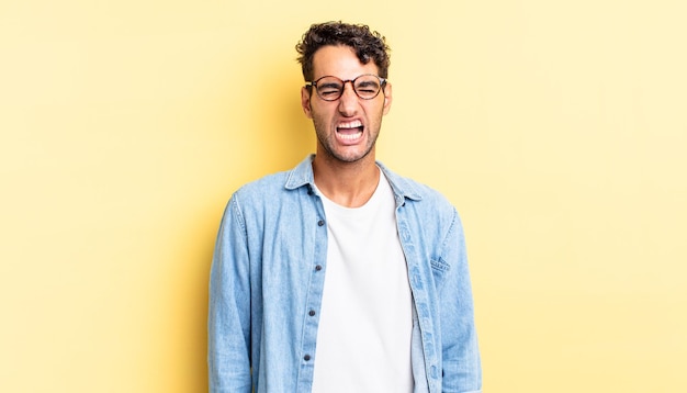 Photo hispanic handsome man shouting aggressively, looking very angry