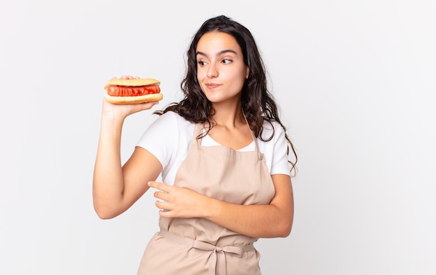 hispanic pretty chef woman against isolated wall