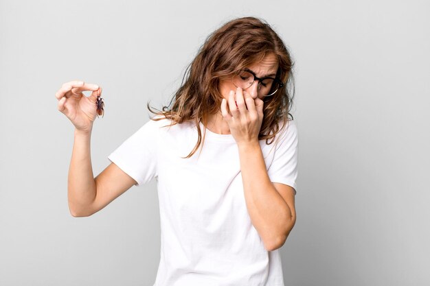 Hispanic pretty young woman holding a cockroach disease concept