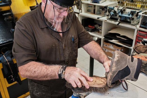 Hispanic shoemaker working in a workshop