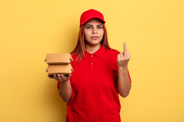 Hispanic woman feeling angry annoyed rebellious and aggressive take away deliver concept