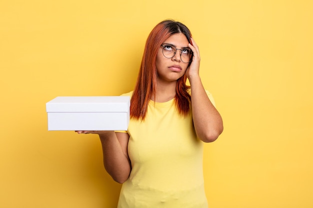 hispanic woman feeling bored, frustrated and sleepy after a tiresome. empty packaging concept