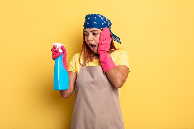 Photo hispanic woman feeling happy excited and surprised cleaning and housekeeper concept