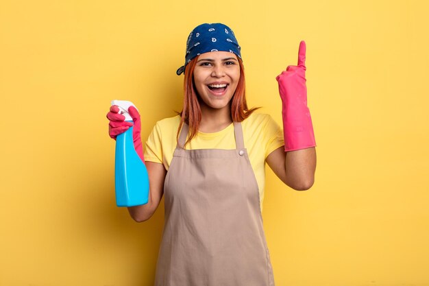 Hispanic woman feeling like a happy and excited genius after\
realizing an idea cleaning and housekeeper concept